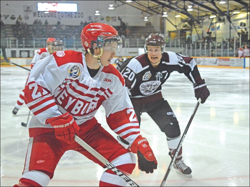 Flin Flon Bombers centreman Alex Smith approaches a Weyburn Red Wings player during a game earlier this season. Smith has been named RBC SJHL Player of the Year.