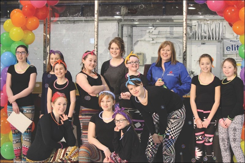 STARSkate girls celebrate a successful ice show. Back row, from left: Suzanne Nelson, Naomi Dickens, Miranda Andrusiak, Ariel Tanchak, Victoria Pedwell, Keira Hagley, Kristen Nolan (coach), Alyssa Andres, and Darah Brown. Front row, from left: Danielle Nelson, Eden Dickens, Kara Burroughs, and Jerilyn Wood.