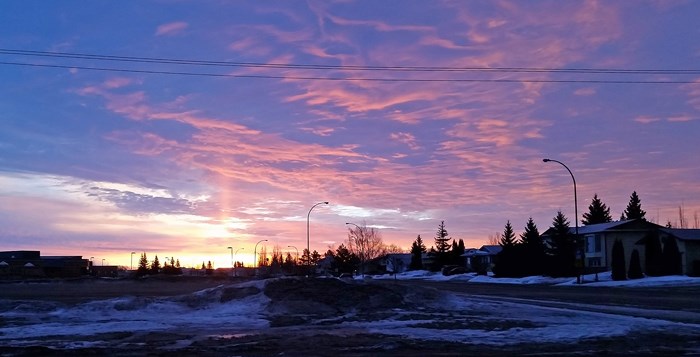 Early Light A pre-7 a.m. sunrise March 13 casts a pink and yellow glow on morning clouds and harkens to the longer days ahead as spring takes hold of the Parkland.