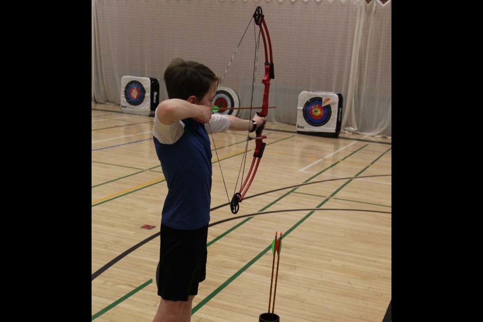 NASP - Dr. Brass student Nathan Matechuk takes a shot as part of the National Archery in Schools Program.