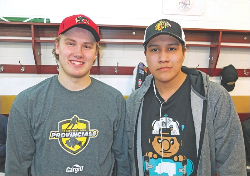 Eric Rutherford (left), MVP for the Flin Flon Rotary, and Mateo Custer, MVP for the Deschambault Lake Eagles, wearing the NHL ballcaps that came with the honour.