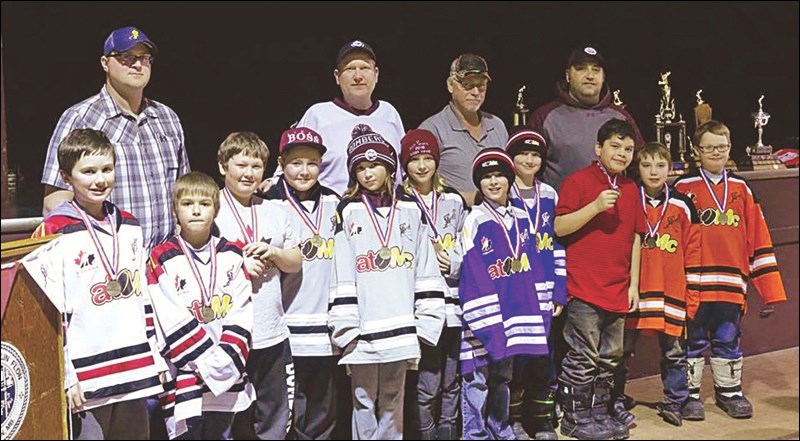 Front row, from left: Cole Eardley, most sportsmanlike, Hitmen; Owen Durette, most improved, Hitmen; Paxton Deirechuck, most dedicated, Hitmen; Troen Erickson, most sportsmanlike, Wolves; Lia Yaworski, most dedicated, Wolves; Gianna Watt, most improved, Wolves; Carter Kosmenko, most improved, Miners; Zack Davis, most sportsmanlike, Miners; Christopher Francoeur, most improved, Flyers; Ryder Mucha, most dedicated, Flyers; Jack Eastman, most sportsmanlike, Flyers. Missing from picture: Embry Roberts, most dedicated, Miners. Back row: coaches Brett Pearson, Trevor Watt, Tim Davis and Jason Mucha.