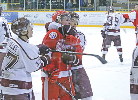 Bombers forwards Jason Lavallee, Brandon Lesko and Brandon Switzer during a melee that broke out following Flin Flon’s 3-2 win on Wednesday night. Things got heated after a Weyburn player attempted to leave the ice with a celebratory moose leg.