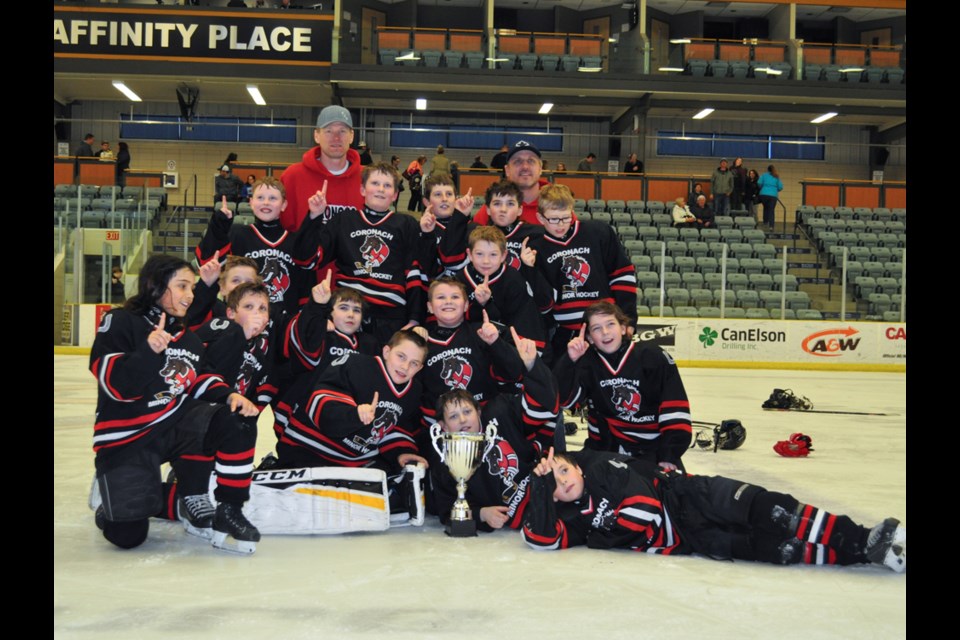 The Southern Broncos celebrate their Estevan Atom Tier Two championship on the ice at Affinity Place.
