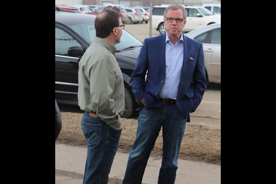 Sask Party Leader Brad Wall meets with his candidate for the Yorkton riding Greg Ottenbreit before a campaign event in Yorkton.