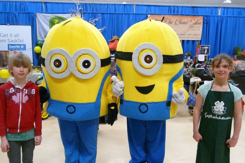 A couple of Minions visited the Norquay Trade Show held at the Communiplex March 18 and 19. With them were Mia Butterfield, left, and Ashlyn Olson.