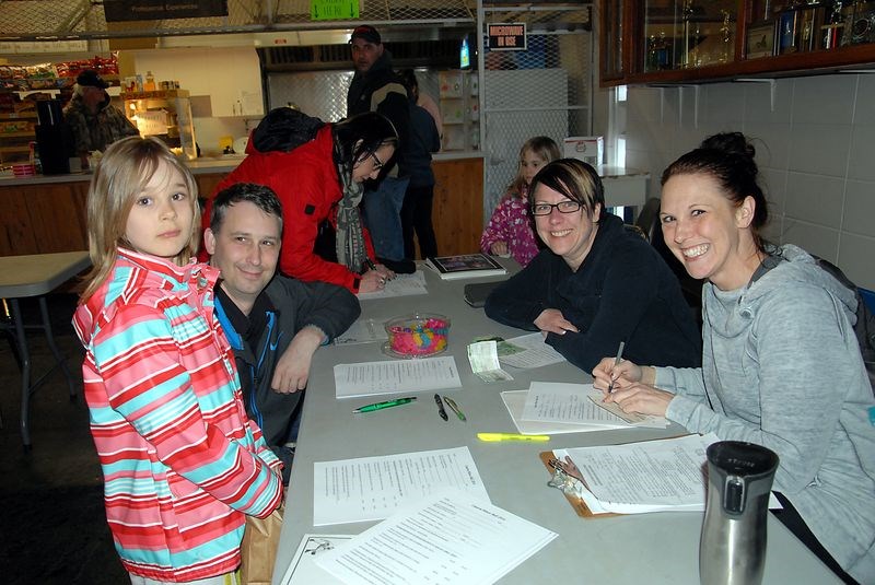 Emile Hvidston was joined by her father, Barry Hvidston, when she registered with the Canora minor ball association on Thursday during the community-wide mass registration event at the Civic Centre. Looking after the minor ball table were Michelle Hembling and Shyla Yannoulis (right).