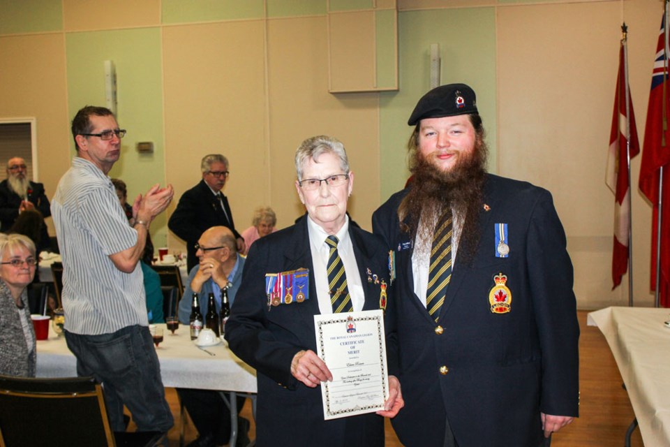 Eileen Rosner accepted a certificate of merit from Estevan Legion president Troy LeBlanc.