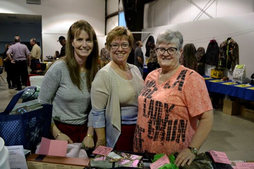 (L-r) Donna Flynn, Carol Brown and Elaine Kraemer were just a few of the volunteers who made the Moose Mountain Wildlife Federation's 14th Annual Fundraiser and Auction a success. Held at Arcola's Prairie Place Hall on Saturday, April 2, the event was a sell-out, with 280 in attendance. The evening featured a cocktail hour, a beef and pork supper, live and silent auctions, and numerous raffles. All proceeds support the MMWF's many projects throughout southeast Saskatchewan.