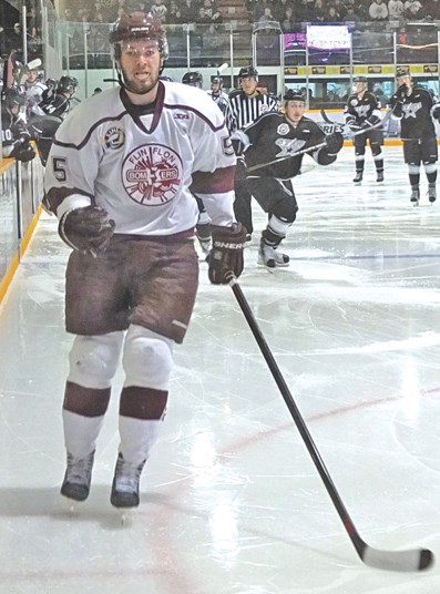 Bombers defenceman Curtis Roach returns to his own end to retrieve an iced puck during Tuesday’s loss.