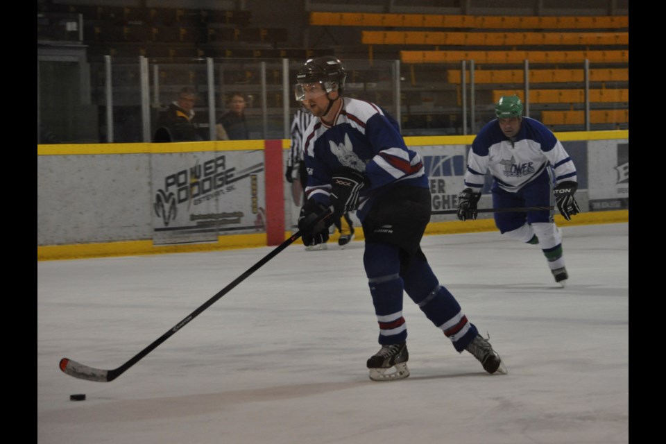 Viking Devin Aspinall breaks in on the Tower Wolves' goal during an all-Estevan matchup at the Civic Auditorium on Sunday.