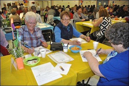 Volunteers enjoyed crayons and colouring pages at their tables. Photos by Jayne Foster