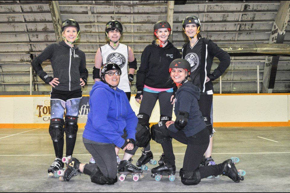 The Hillbilly Hurt senior roller derby team, with back row from left, Carly Hengen, Nikki Wirtz (Ultra), Ricki Selinger (Ricki Bobby), Melissa Holman (Infinate K.Oss); front, Danielle Wysminity (Enviro Pyro) and Khrystyna Vasylkiv, is holding two free learn-to-skate classes at Trinity Lutheran Church on May 1 and 3. Photo by Jamie Harkins.