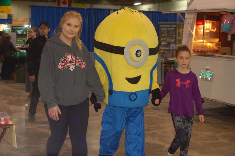 Minions The Minions were in attendance at the Spring Expo trade show in Preeceville held over the weekend. Riely Turchinetz, right, walked with the group.