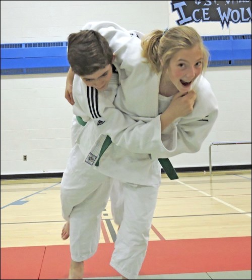 Grace practices her favorite technique on her Judo Saskatchewan teammate, Slavko.