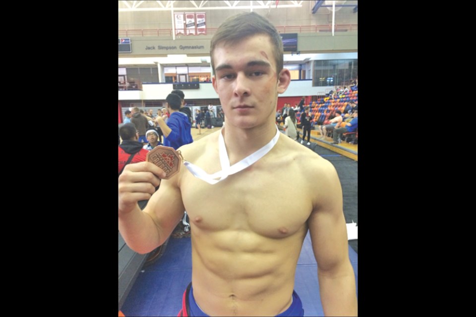 Hunter Lee with his bronze medal from the Greco-Roman event at the Wrestling Canada Championships earlier this month.