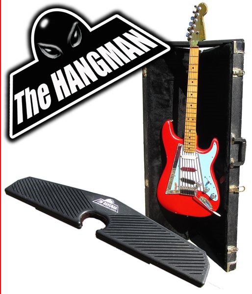 This device, which is called The Hangman (at bottom of picture) and was invented by Cole Smith of Kamsack, when placed on top of an opened guitar case (at right) allows a guitarist to rest his guitar between uses.