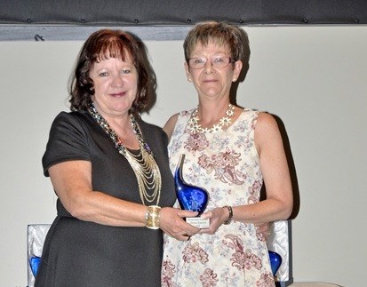 Theresa Knutson (right) received a Mental Health Employee Award from Lucy Bendall.