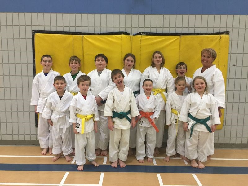 Students of the Kamsack Karate Club for the 2015-16 season, who were photographed with their sensei Gwen Maddaford of Yorkton (at right) from left, included: (back row) Kyler Kitsch, Ty Martin, Mason Russell, Makayla Romaniuk,Tamera Auchstaetter and Curtis Berezowski, and (front) Kennan Kitsch, Timothy Holoboff, Murdock Martinuik, Parker Lorenzo, Macy Martinuik and Meesha Romanuik. Ally Warriner, Keifer Cote and Peyton Musqua were not available for the photograph.