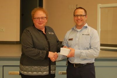 Barb Leason was presented with a 25-year staff service award at the Preeceville branch of the Crossroads Credit Union during the annual meeting in Sturgis on April 18. From left, were: Leason and Jeff Bisschop, the manager of lending.