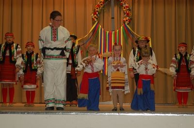 The Barveenok Ukrainian Dance Club members performed a “welcome dance” at the annual spring concert on May 1. Presenting the traditional wheat, bread and salt, from left, were: Shae Peterson, Dillion Serdachny, Allie Babiuk and Keltyn Konkel.