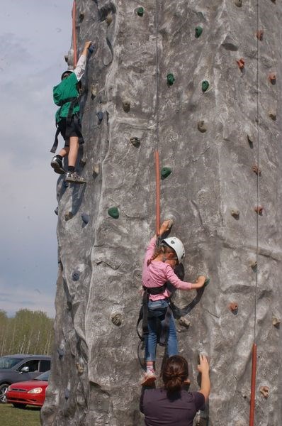 Xerais Galay, left, and Amrie Seerey had fun climbing the rock wall at the Sturgis Community Hall on May 5.