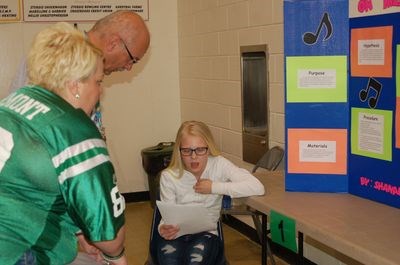 Merv Tomski and Michelle Hanson had the difficult task of judging students’ science experiments at the Sturgis science fair on May 6. Shanae Olson explained her experiment.