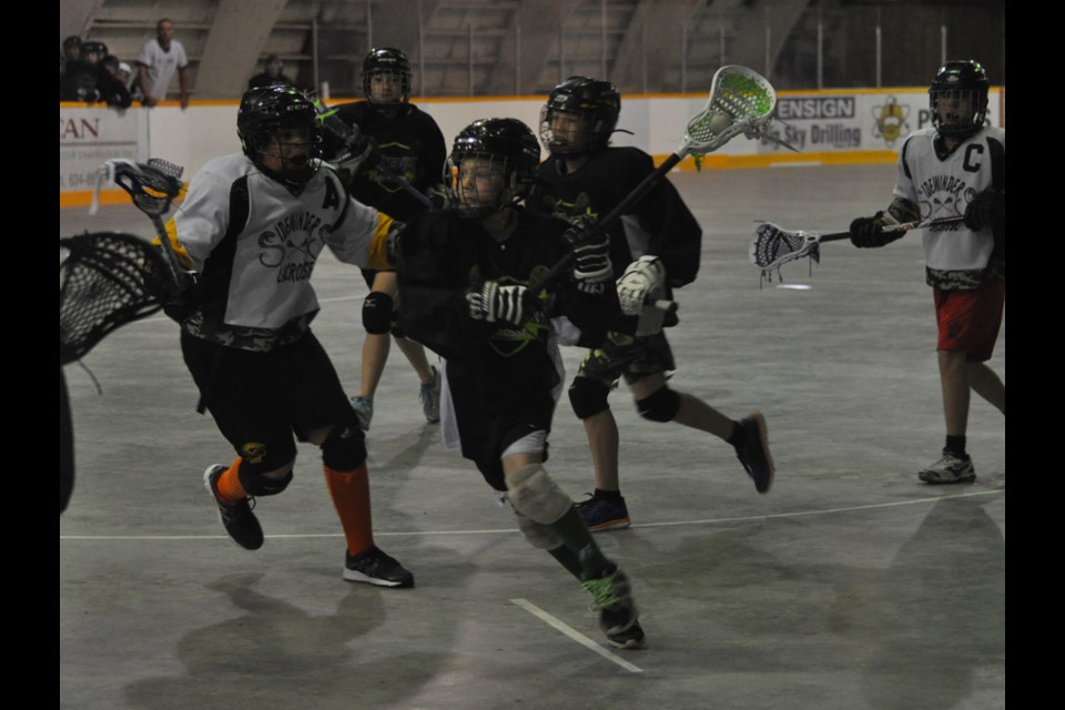 Voltz player Kersey Hollingshead drives toward the Sidewinders' net.