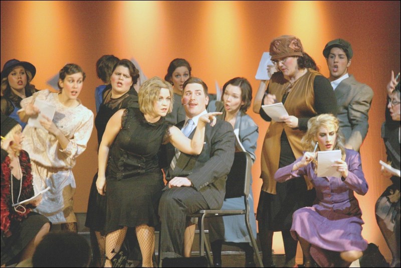 A scene from the choir’s 2013 production of Chicago: The Musical, featuring Miranda Bowman as wannabe-showgirl Roxie Hart and Julian Kolt as criminal lawyer Billy Flynn.