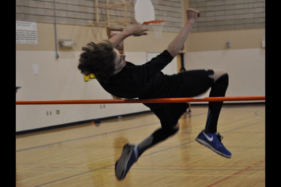 Pleasantdale's Kaleb Poole catches some air in the high jump competition.