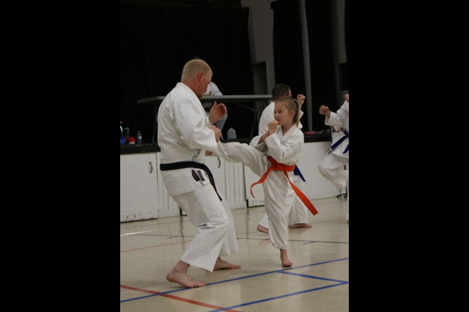 Moose Mountain Wado Kai grading took place on Tuesday, May 24, with youth and adults being graded on their abilities including general skill, kata, and kumite. Here a young girl displays a kick for the panel.