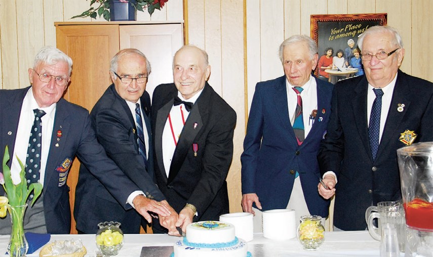The five charter members in attendance at the 50th anniversary program for the Father DeCorby Council of the Knights of Columbus were given the honour of cutting the anniversary cake on Sunday at St. Joseph’s Roman Catholic Church on Sunday, from left, were: Ed Yasinski, Michael Spelay, Steve Hrynkiw, Florian Slogocki and Steve Gulka. Charter members not in attendance were: John Fylyshtan, Nestor Kyba, Bernard Rink and Henry Wyonzek. Read more about the anniversary program in next week’s edition.