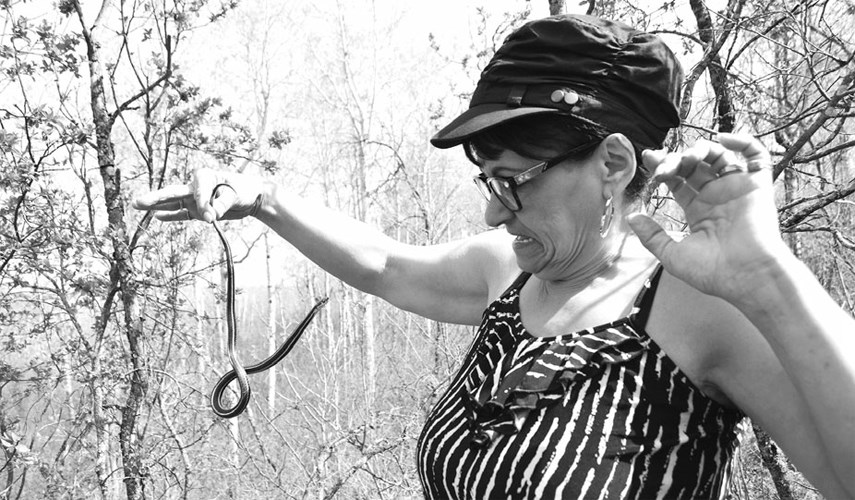 Marcella Davis of Yorkton visited the Fort Livingstone historic site which is well known for its infestation of garter snakes. She accompanied her relatives, the Jeff and Jennifer Bisschop family of Canora, which make an annual trip to see the snakes in spring