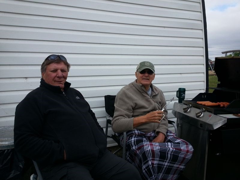 Jim Dzikowski, left, and Don Boyd of Runnymede were the volunteers manning the barbecue at Runnymede on Saturday.