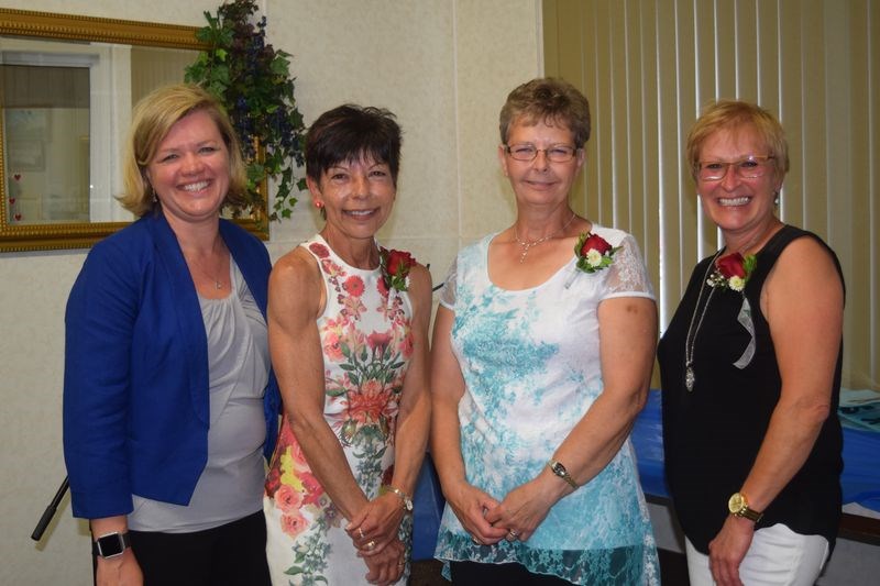 At the reception held Friday in honour of the Sunrise health Region’s Kamsack employees, Loralee Davis, left, presented retirement gifts to: Deborah Cottenie, Frances Bowes and Arlene Tataryn.