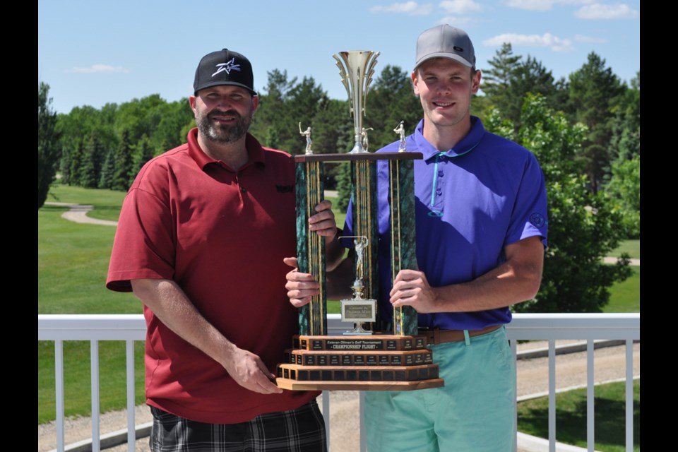 Oilfield Technical Society president Conrad Meili, left, presents Anthony Melle with the championship flight trophy.