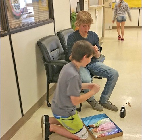 Students assembling a toy gift for children impacted by the Fort McMurray evacuation. Photos submitted