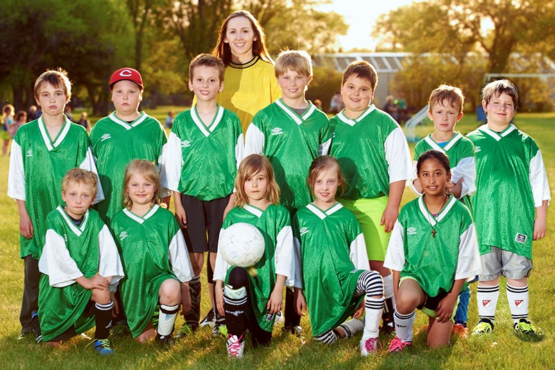 Members of the Lucky Leprechauns soccer team with their coach Janayah Merriam, from left, are: Jim Grayson, Jace Wolos, Connor Kraynick, Joey Palagian, Logan Grabowski, Lucien Carlson and Lucas Belitski, and (front) Cayden Kelly, Brenna Reine, Emilie Hvidston, Natalia Kelly and Methyl Trask. Photo courtesy of Craig Popoff of Canora Photo and Framing.