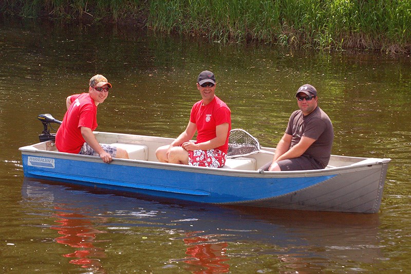 The Sturgis Kinsmen Club sponsored its annual Duck Derby on June 5. In the water, collecting ducks as they crossed the finish line, from left, were: Tyler Blender, Craig Folk and Chris Walker.