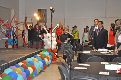 The officials and special guests for last Friday's citizenship ceremony were piped in to the Summer Hall at the Western Development Museum. Photos by Jayne Foster