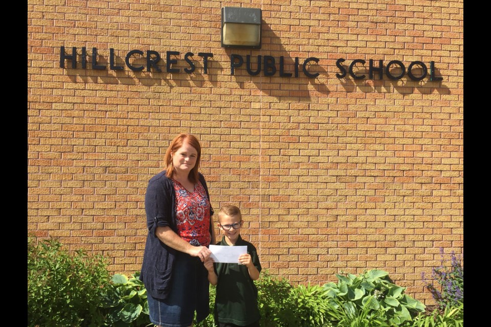 Charlie Hayes of the Benson 4-H Beef Club presented the proceeds from the club’s bake sale and barbecue to the Hillcrest School Breakfast Club program. Accepting on behalf of the school was Sara Pippus.