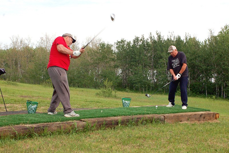 Don Jaeb, left, and Jerome Gulka enjoyed shooting golf balls at the driving range in Preeceville on June 2.