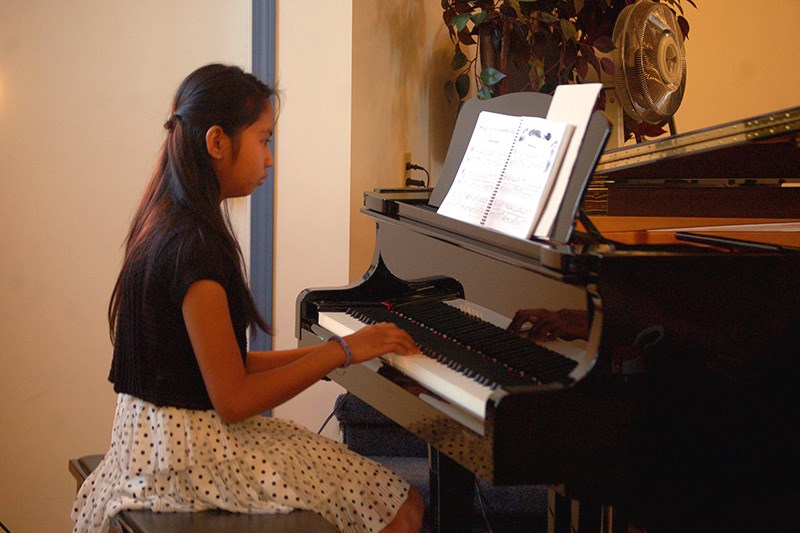 Ellian Singkala performed two musical selections at the piano recital.