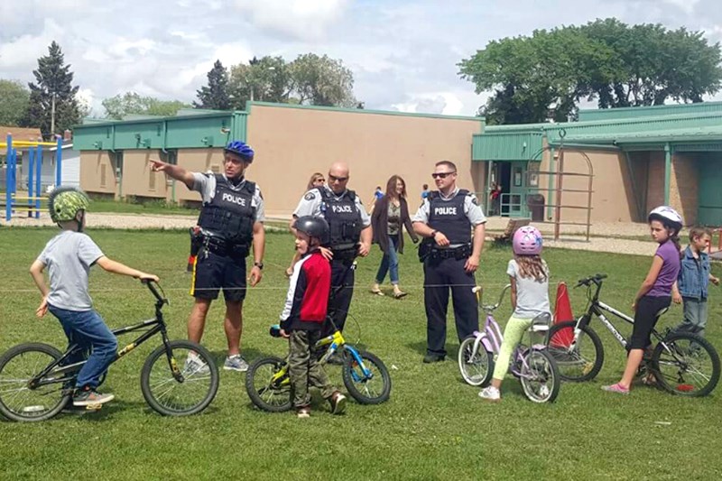 Young cyclists lined up on the grounds of the CJES for the annual Bike Rodeo on May 3.