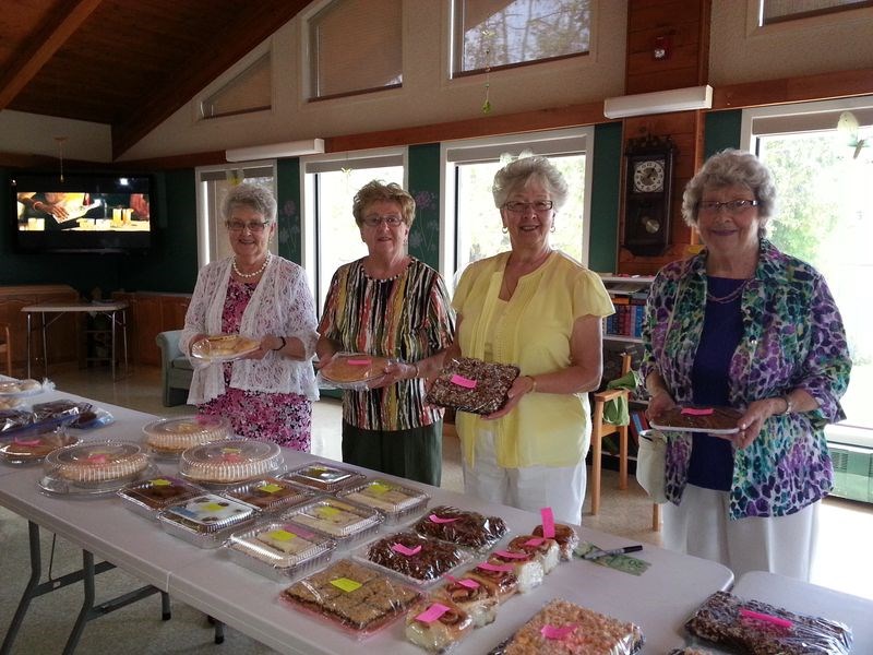 Organizers of the bake sale table at the Kamsack and District Nursing Home auxiliary tea and bake sale were, from left, Bev Scobie, Eileen Chutskoff, Bernice Makowsky and Millie Currie.