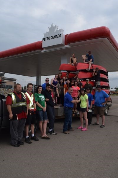 Before heading off on their five-day outdoor education experience on Thursday, the KCI Voyageurs stopped at the Kamsack Petro-Canada outlet where their truck and two vans were filled with fuel. Petro-Canada had donated all the fuel for the three vehicles to take the group to and from the place where the group was to experience canoeing in northern Saskatchewan, which is about 95 kilometres north of LaRonge. While at the service station, Regan Nichol, on behalf of the group thanked Rob Ritchie, owner of the Kamsack Petro-Canada service station.