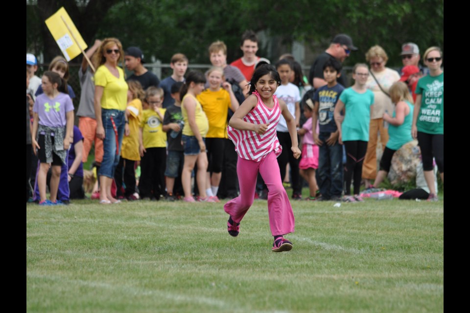 Roza Khan sprints down the track in the relay event.