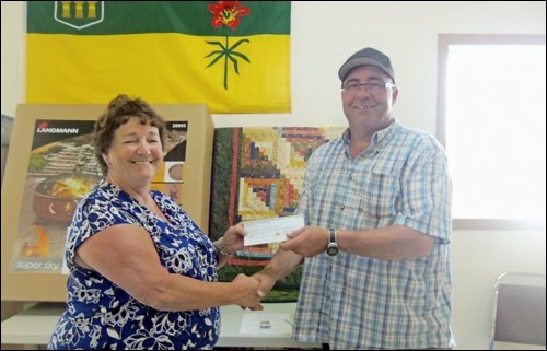 Rodney Weisner, chairman of the Waseca Recreation Board presented 2016 fish gry proceeds to local organizations on June 19. Accepting on behalf of Waseca Community Centre was Arlee Lumgair.