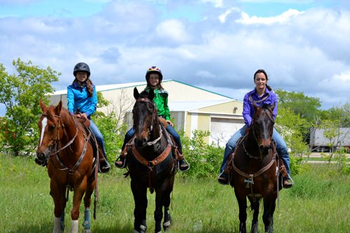 The 1st Annual Round-Up Rodeo, held in Kennedy on Sunday, June 12, attracted  competitors from all ages from throughout the province. Pictured are: (l-r) Gracie Hillrud, 11 and her horse, Yoda, Mazey Hillrud, 10 and her horse, Rock, and their mom, Dawn Hillrud, with her horse, Buddy. The Hillruds travelled from Ceylon, Sask. to take part in the day-long event.