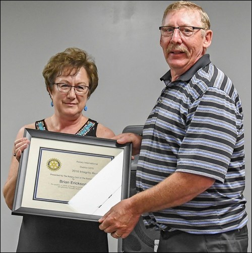 Brian Erickson receives the Integrity Award from Johanne Stolz. Photos by Averil Hall.
